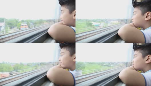 亚洲孩子的脸在火车上，高清在线视频素材下载