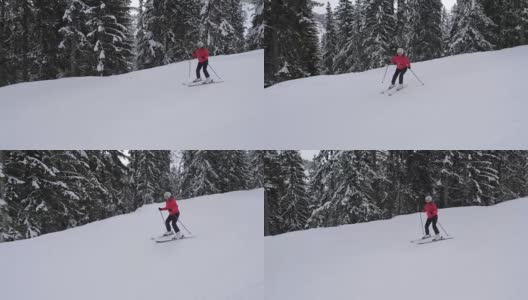 初学滑雪的人小心地用滑雪板滑下山坡高清在线视频素材下载