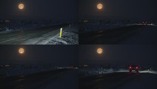 夜晚驾驶在巨大的满月下冰雪覆盖冰岛的道路高清在线视频素材下载