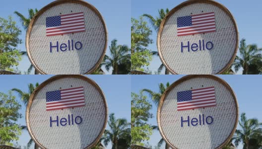 美丽的标志与美国国旗和题词你好英语。用“你好”签名高清在线视频素材下载