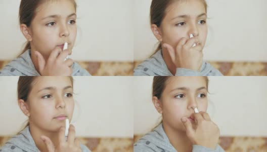 十几岁的女孩用鼻喷雾剂高清在线视频素材下载