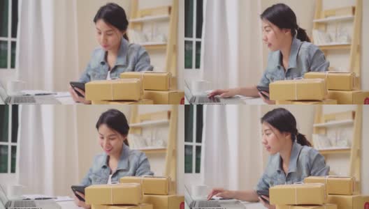 聪明的亚洲年轻企业家女企业家企业主中小企业在线检查产品库存和节省到笔记本电脑在家里工作。小企业主在家办公的概念。高清在线视频素材下载