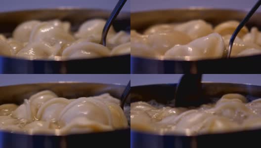 宏人在锅里搅拌汤圆，勺映窗高清在线视频素材下载