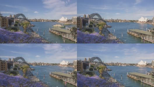 悉尼，新南威尔士/澳大利亚——大约2010年:Zoom Timelapse，轮渡将游客和当地人带到他们的目的地，在环形码头上，海港大桥和悉尼歌剧院作为背景。高清在线视频素材下载