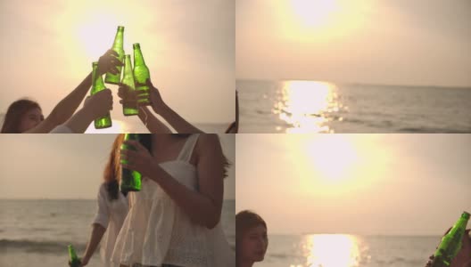 慢动作的手在日落的海滩上敬啤酒瓶，胜利，庆祝高清在线视频素材下载