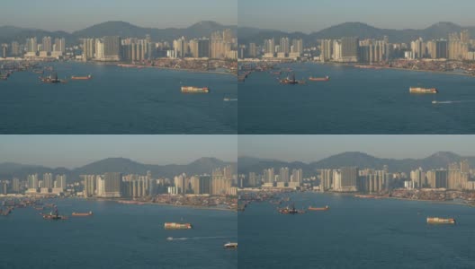 香港维多利亚港工业港附近的天际线、海岸和船只高清在线视频素材下载