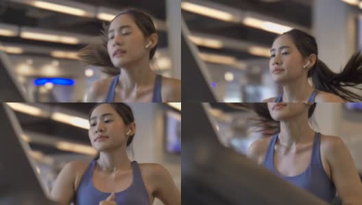 年轻漂亮的女人在健身房锻炼在跑步机上跑步高清在线视频素材下载
