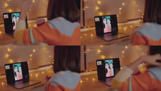 亚洲妇女用笔记本电脑在家里和朋友视频聊天高清在线视频素材下载