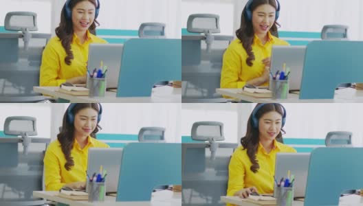 快乐年轻的亚洲商务女性戴着耳机与她的业务团队在现代办公室或联合办公空间进行在线视频电话会议，创业概念高清在线视频素材下载