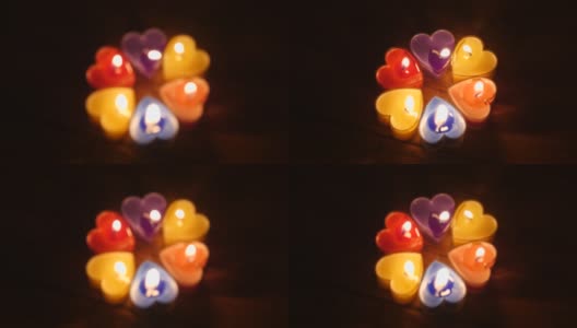 烛光在夜晚燃烧，心形，圣诞快乐，新年快乐。高清在线视频素材下载