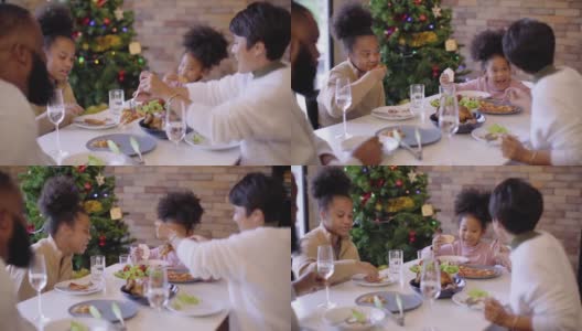 非裔美国人家庭聚会庆祝和享受传统的节日晚餐或午餐感恩节或圣诞节高清在线视频素材下载