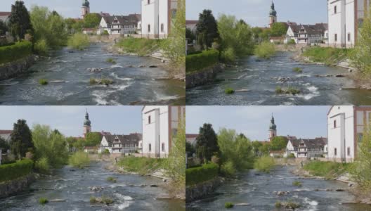 在风景如画的德国教堂中，可以看到山的堤岸、湍急的小溪和威尔斯特村高清在线视频素材下载