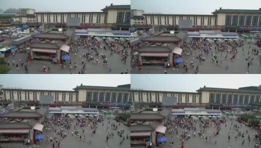 镜头:中国西安火车站广场上挤满了行人高清在线视频素材下载