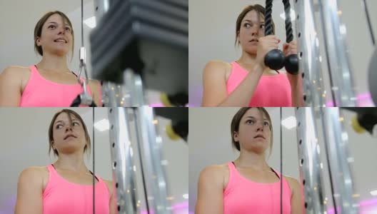 一个强壮的年轻女子在健身房锻炼高清在线视频素材下载