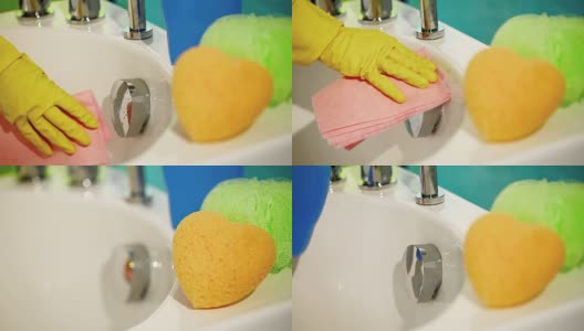 手戴手套，用抹布擦拭浴缸，打扫浴室高清在线视频素材下载