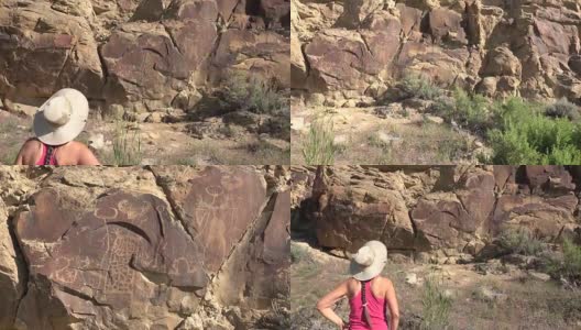 女人探索古老的岩画，怀俄明州传奇的岩石州考古遗址高清在线视频素材下载