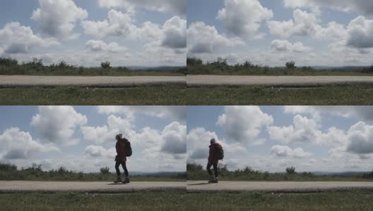 一个徒步旅行的女孩在乡村公路上搭便车的慢动作高清在线视频素材下载