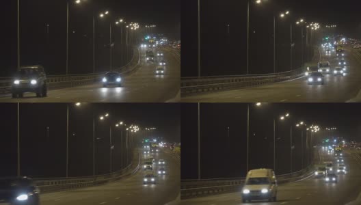 夜间公路交通车辆。傍晚，汽车在桥上行驶。黑暗中的高速公路。加里宁格勒-高清在线视频素材下载