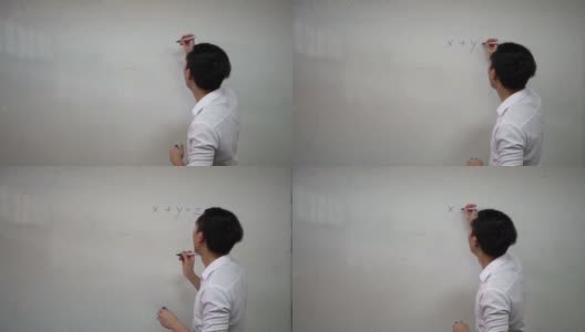 年轻英俊的亚洲数学老师正在白板上写数学公式。教育与办学理念高清在线视频素材下载