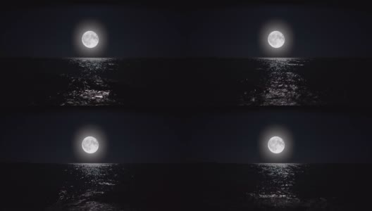 夜晚的满月倒映在水面上。高清在线视频素材下载