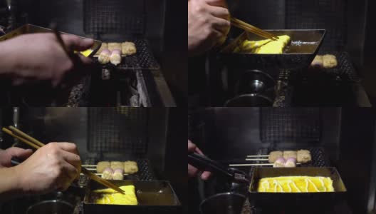 慢镜头拍摄在街头小吃市场的金属锅里的玉烧煎蛋卷高清在线视频素材下载
