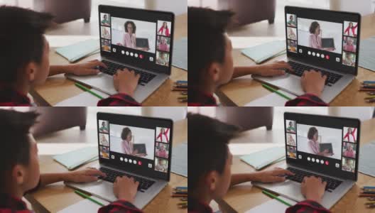 一个亚洲男孩在家里用笔记本电脑与老师和同学进行视频会议高清在线视频素材下载