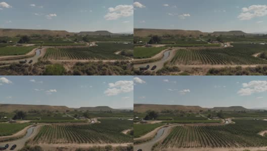 夏末无人机查看科罗拉多河流域农业绿地和水处理和BookCliff山脉4K视频系列高清在线视频素材下载
