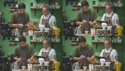 亚洲华人男咖啡师咖啡店老板正在和他的员工进行冷煮咖啡点滴培训高清在线视频素材下载