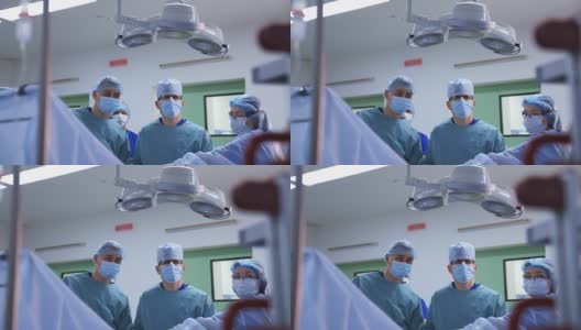 手术室里的一群医生。主任外科医生、护士等医务人员在现代化医院办公室进行外科手术。高清在线视频素材下载