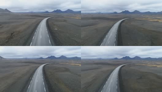 从冰岛鸟瞰一条沙漠公路高清在线视频素材下载