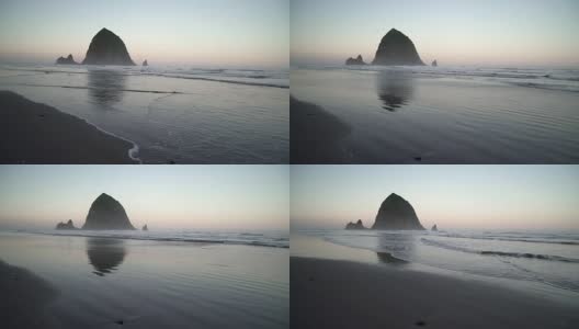 干草堆岩，加农海滩黎明摄影车拍摄了4K。UHD高清在线视频素材下载