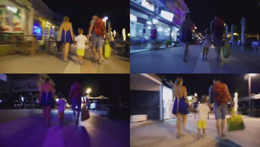 一家人在夜晚的街道上散步高清在线视频素材下载
