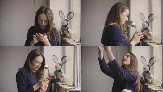 快乐的女人在家里窗户边用手机自拍高清在线视频素材下载
