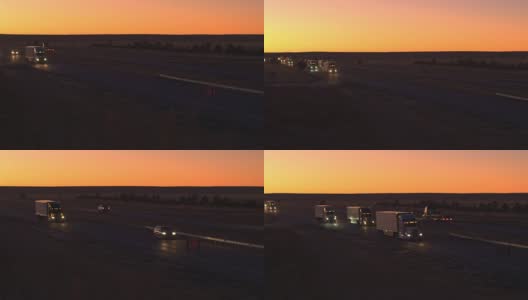 天线:货车在高速公路上行驶，在日出时运送货物高清在线视频素材下载