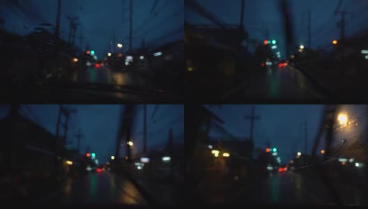 在雨夜开车。雨落在POV前视图的汽车。视频缓慢的运动。高清在线视频素材下载
