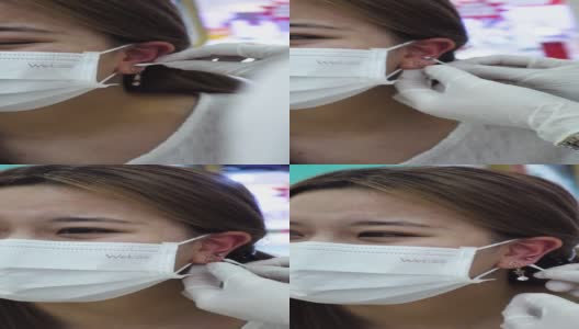 美容院，美容师为年轻少女做耳洞手术高清在线视频素材下载