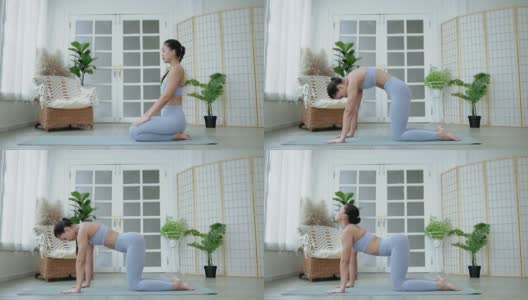 瑜伽亚洲妇女练习瑜伽姿势在她的静修或健身房，保健概念，锻炼高清在线视频素材下载