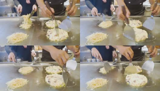 厨师的手正在做日式御好烧高清在线视频素材下载