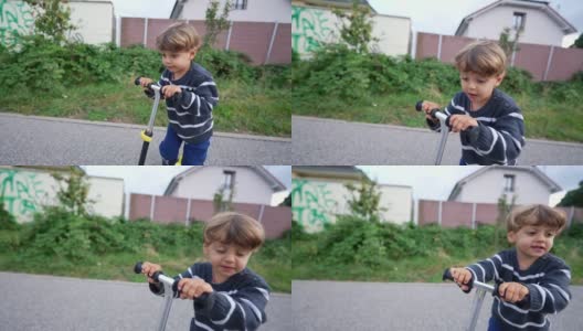 小男孩在外面骑着三轮摩托车，快乐的孩子骑着摩托车高清在线视频素材下载