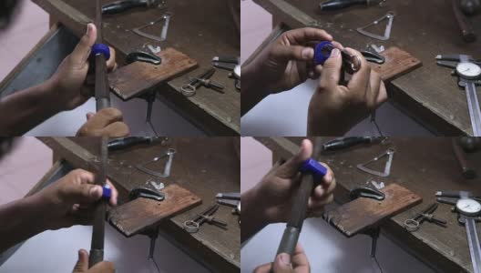 珠宝工匠打磨戒指的蜡模用粗平锉高清在线视频素材下载