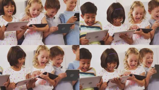 孩子们笑着，用着平板电脑高清在线视频素材下载