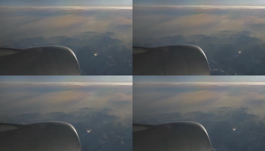 晴天飞行飞机引擎乘客窗口查看全景4k中国高清在线视频素材下载