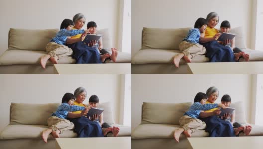 祖母在台湾的一个家庭给孩子们读书高清在线视频素材下载
