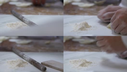 用慢动作，厨师在包饺子之前先把面团擀开高清在线视频素材下载