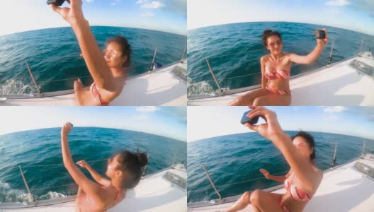 宽拍美女亚洲女人穿着比基尼幸福在豪华游艇甲板上与蓝天和海湾的泰国芭堤雅高清在线视频素材下载
