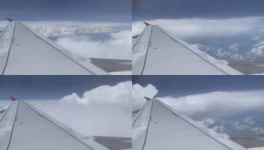 飞机在蓝天白云之上飞行。飞机窗外的美景;小翼在Cloudscape背景上。高清在线视频素材下载