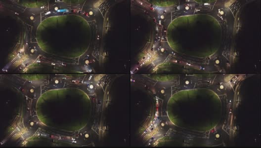 英国一架4k无人机拍摄的车辆夜间在环岛行驶的视频高清在线视频素材下载