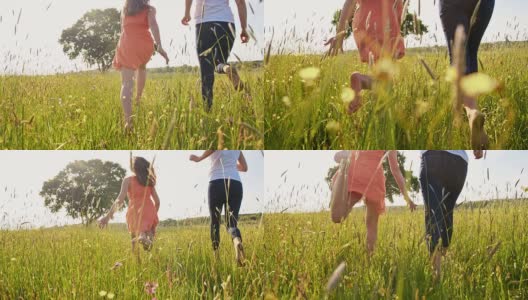 快乐的女人和女孩赤脚在草地上奔跑高清在线视频素材下载