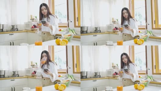 快乐的亚洲女人在厨房喝橙汁，健康的饮食和健康的概念。高清在线视频素材下载