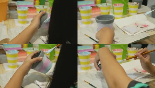 女孩用画笔作画高清在线视频素材下载